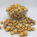 Caramel The Popcorn Loft caramel popcorn cups in golden toffee with crunchy caramel coated kernels