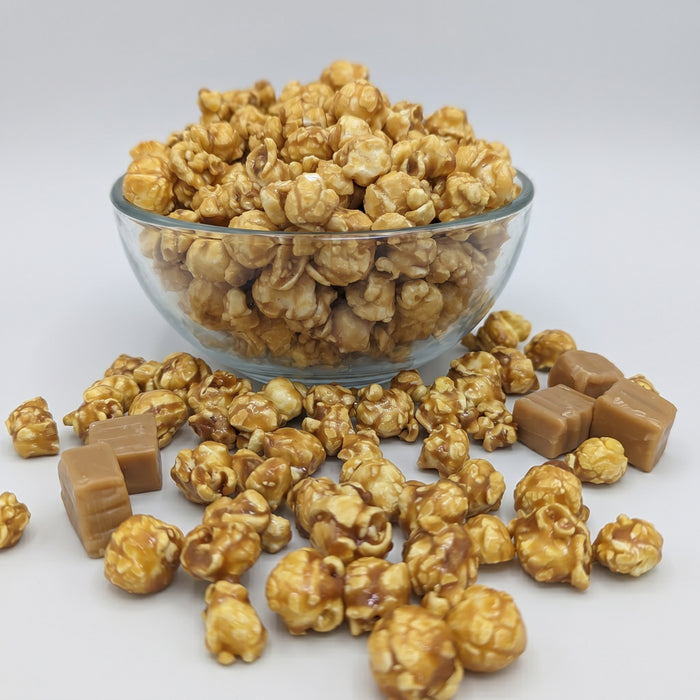 Caramel The Popcorn Loft caramel popcorn cups in golden toffee with crunchy caramel coated kernels