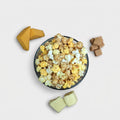 Yorker The Popcorn Loft caramel popcorn snack mix with sweet and savory popcorn pieces in a clear bowl