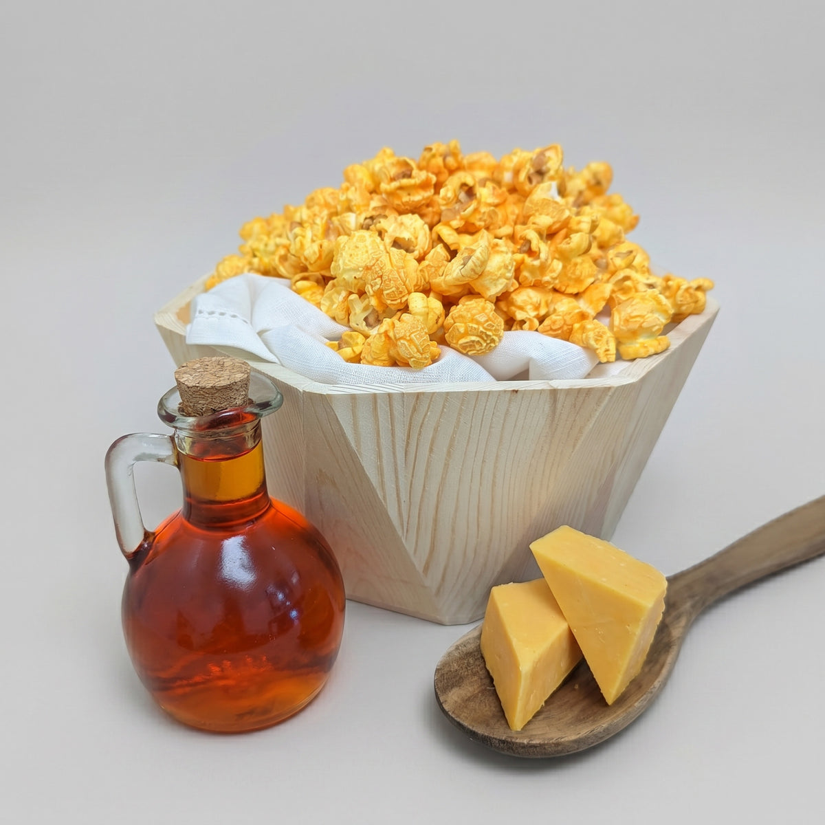 Cheddar Cheese- Fundraiser The Popcorn Loft cheddar cheese fundraiser snack with golden popcorn and white napkin