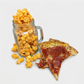 Mason jar filled with popcorn and a slice of pepperoni pizza on a light gray background