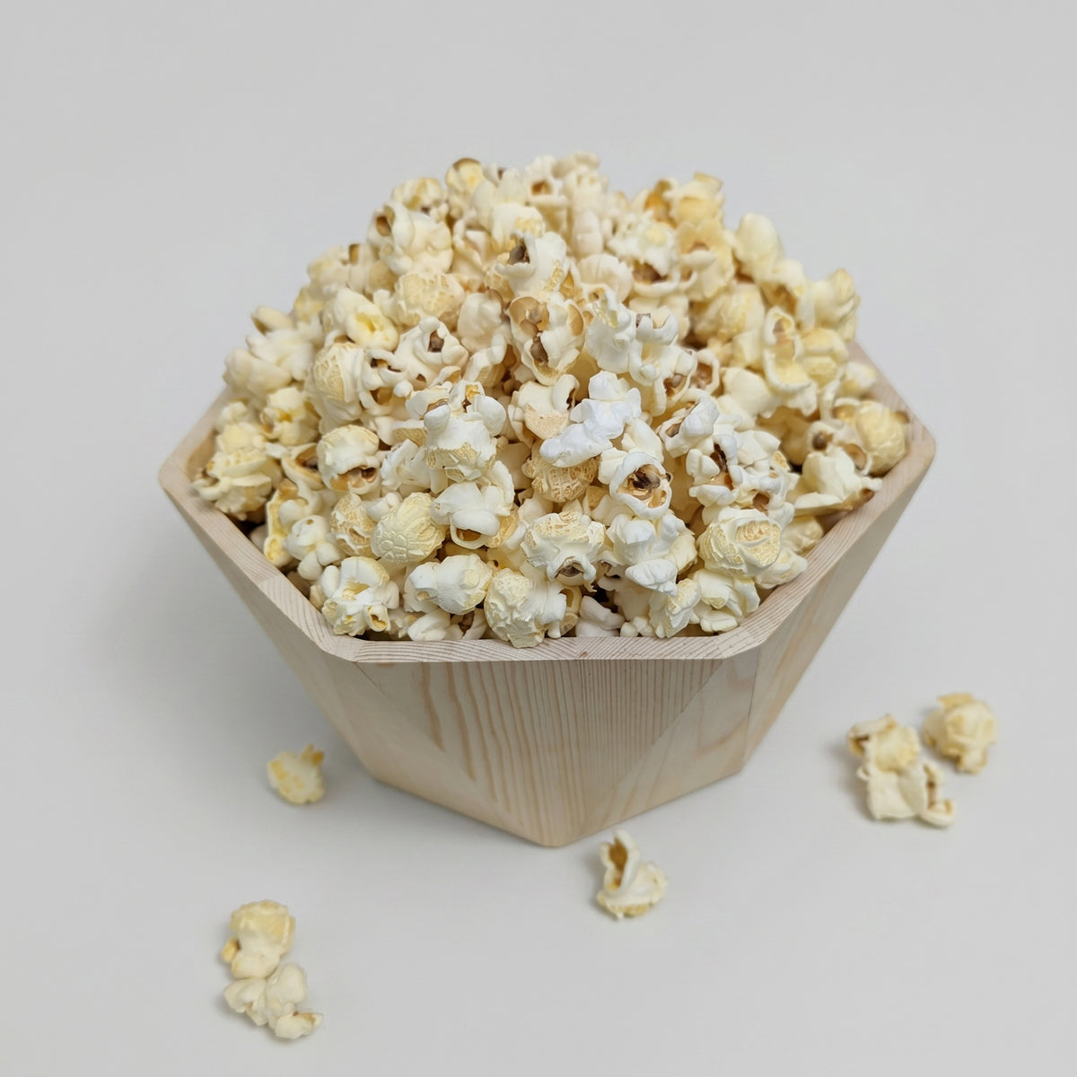 Low Salt The Popcorn Loft popcorn snack in a wooden bowl, butter flavored and low salt
